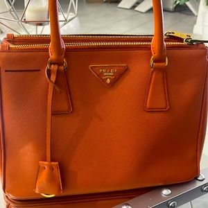 Prada bag in great condition comes with long straps and key chain.